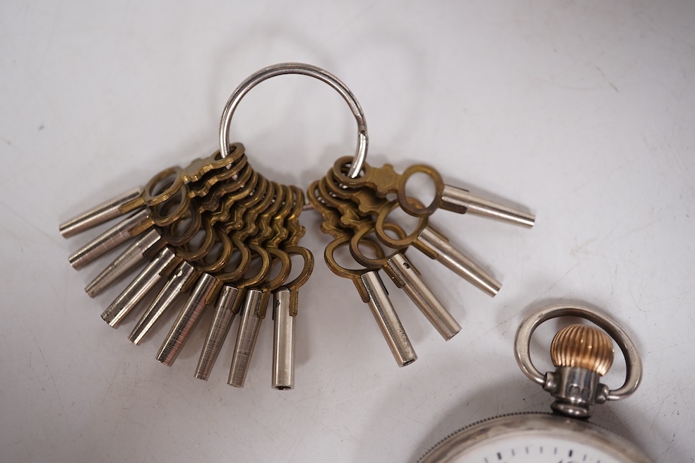 Three early to mid 20th century silver open faced pocket watches, with Roman or Arabic dials and subsidiary seconds, including two keyless and one key wind (Admiral Tacy Watch Co), together with one smaller silver open f